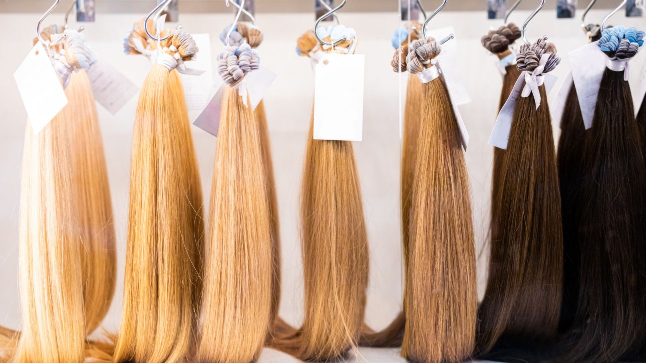 Exhibition of multicolored hair extensions in beauty salon