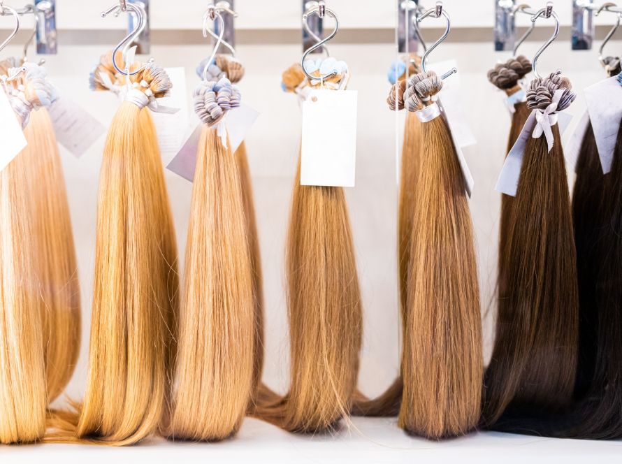 Exhibition of multicolored hair extensions in beauty salon